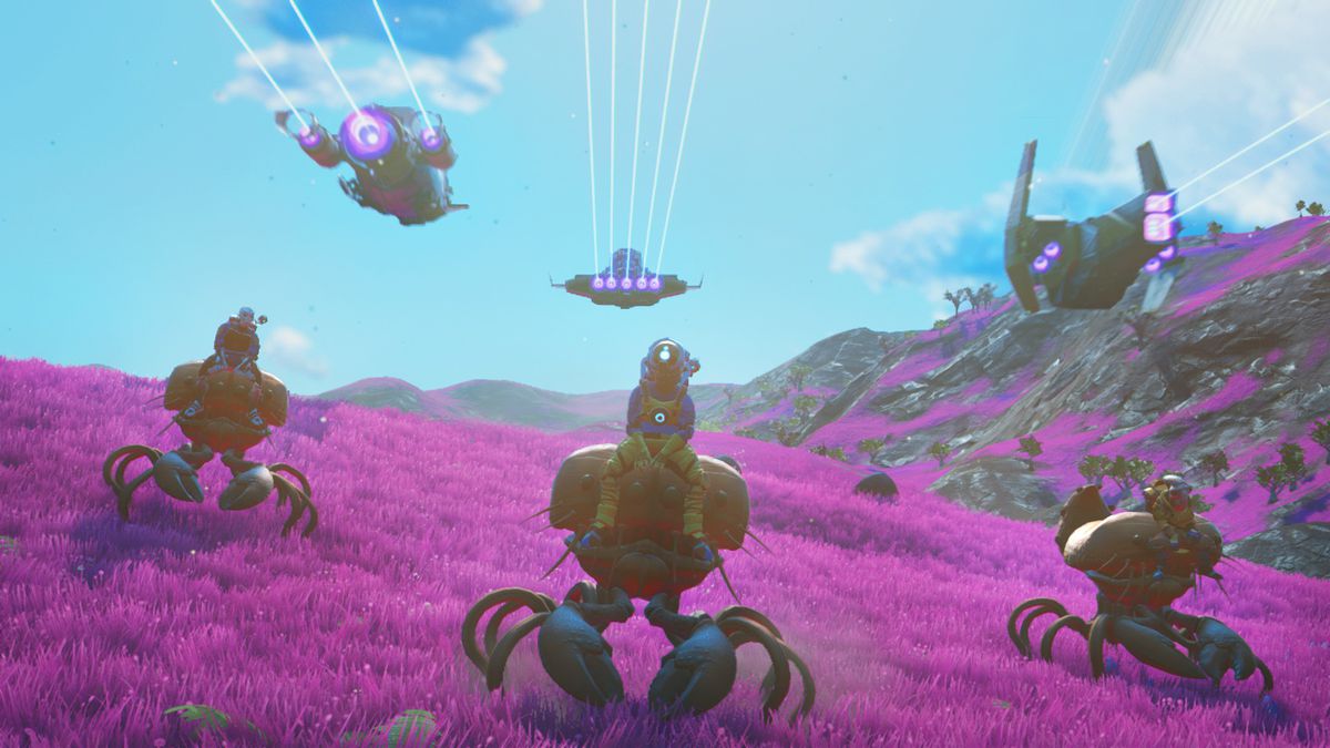 three players in No Man’s Sky, each sitting on an alien creature on a gentle hill of magenta grass, as three spaceships fly overhead