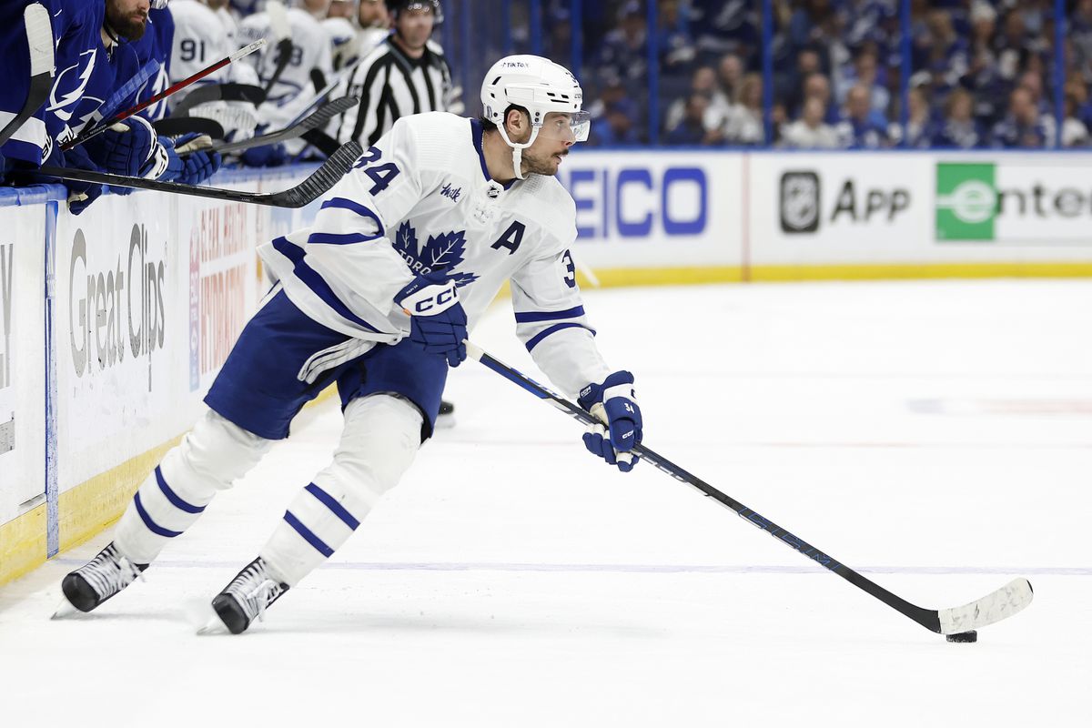 Auston Matthews of the Toronto Maple Leafs looks to pass in the third period during Game Three of the First Round of the 2023 Stanley Cup Playoffs against the Tampa Bay Lightning at Amalie Arena on April 22, 2023 in Tampa, Florida.
