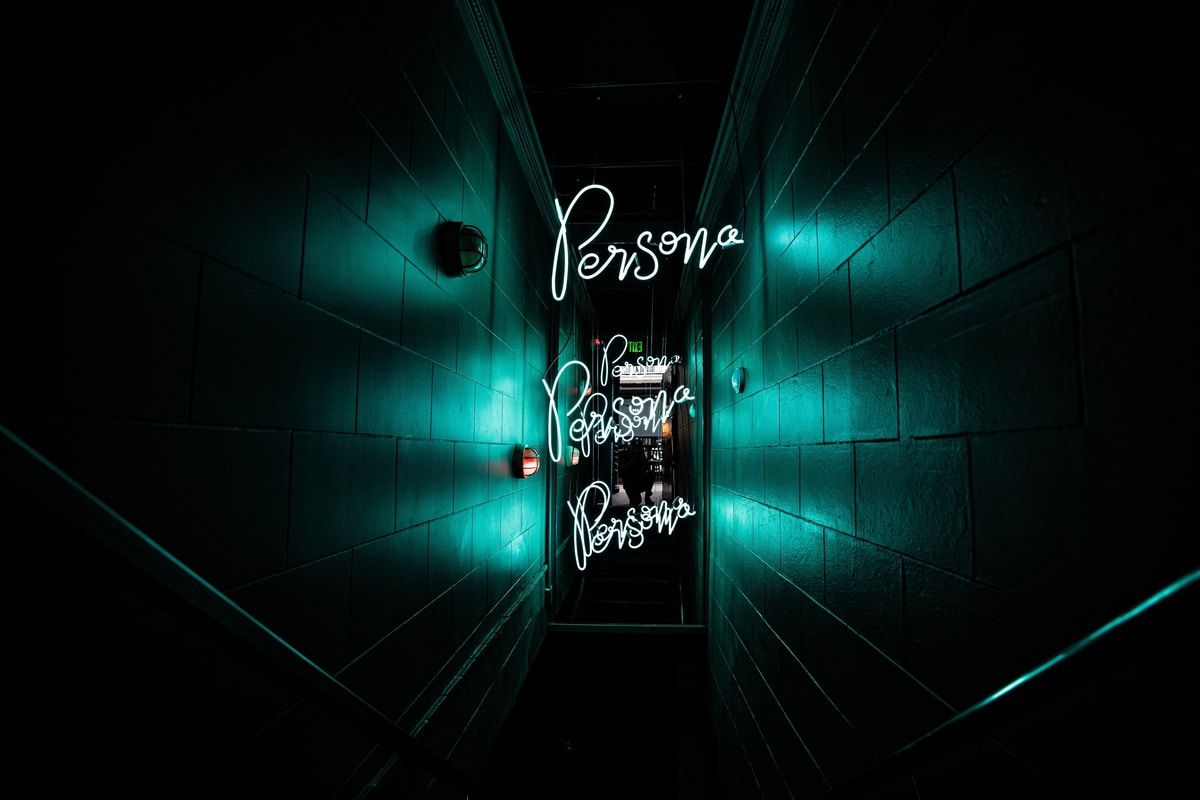 Dark neon entrance to Persona bar