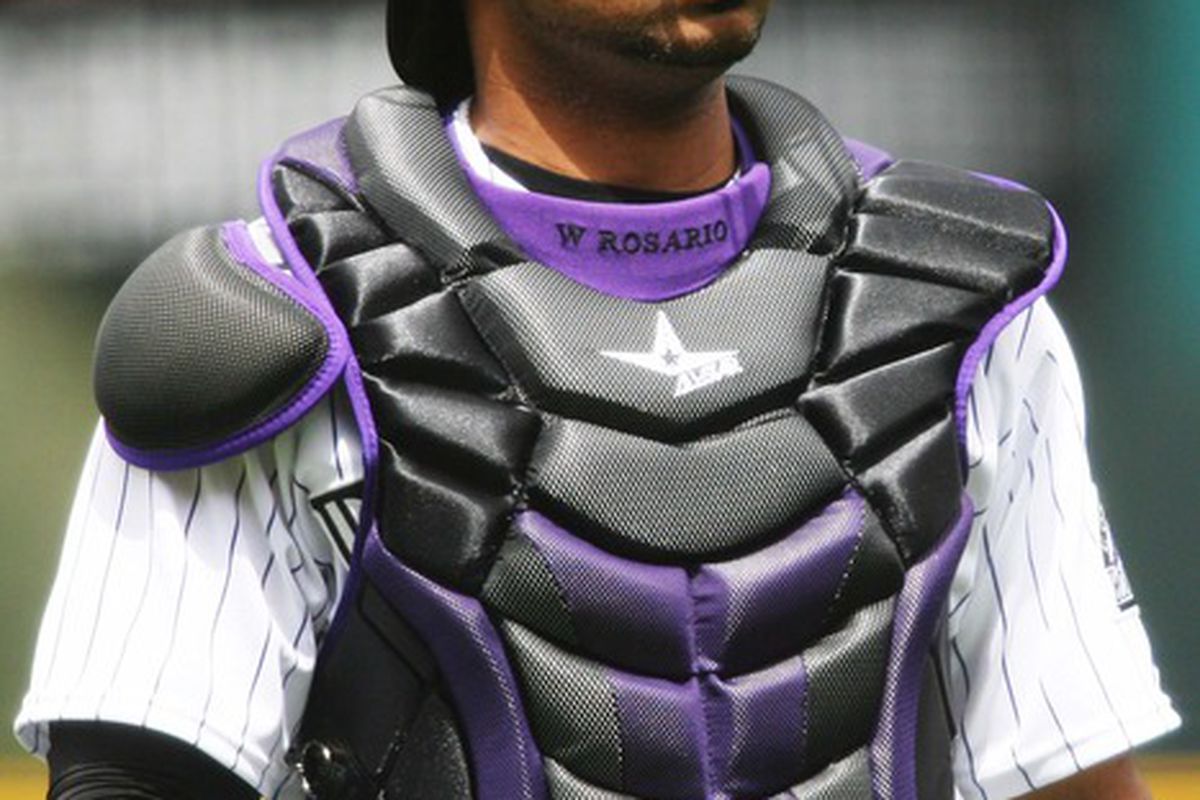 April 12, 2012; Denver, CO, USA; Colorado Rockies catcher Willin Rosario (20) during the first inning against the San Francisco Giants at Coors Field.  Mandatory Credit: Chris Humphreys-US PRESSWIRE