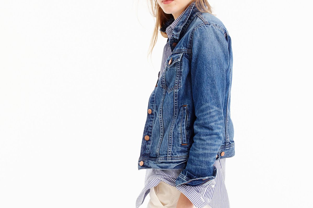 A model wearing a J.Crew denim jacket and white pants