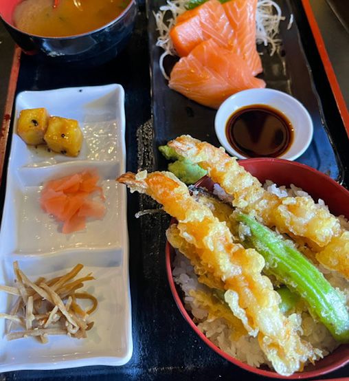 Japanese bento box with tempura shrimp bowl and side dishes at Wa Dining Okan