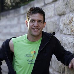 Marathon runner Joe Berti poses for a photo in Austin, Texas, Thursday, April 18, 2013. Berti had just finished the Boston Marathon seconds before two bombs exploded at the finish line. Two days later, he was in his home state of Texas when he saw a fertilizer plant explode near Waco. 