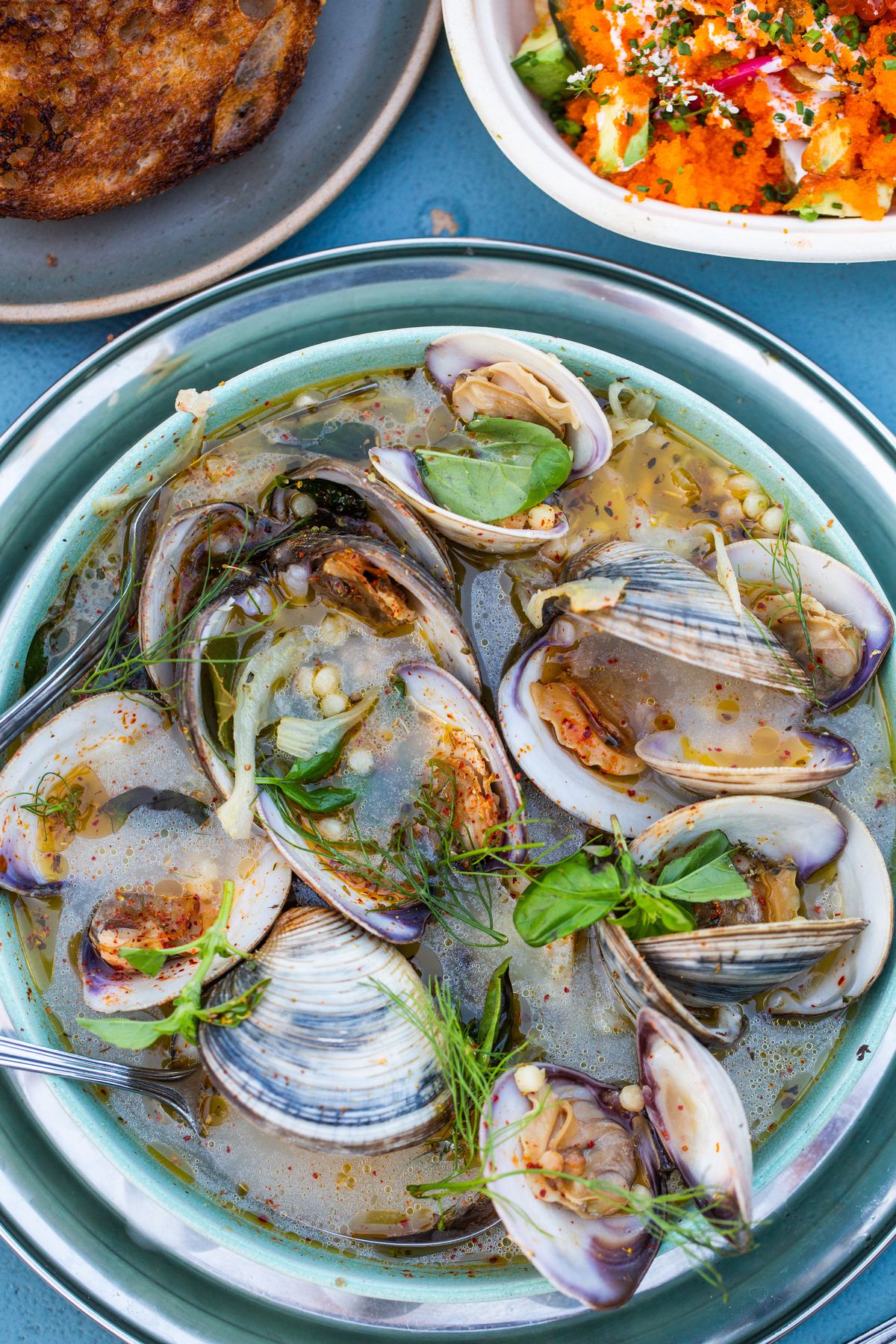 Steamed clams with fresh herbs from Crudo e Nudo.