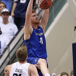 Creighton Bluejays center Geoffrey Groselle (41) slams home a dunk as BYU and Creighton play in NIT quarterfinal action at the Marriott Center in Provo Tuesday, March 22, 2016.