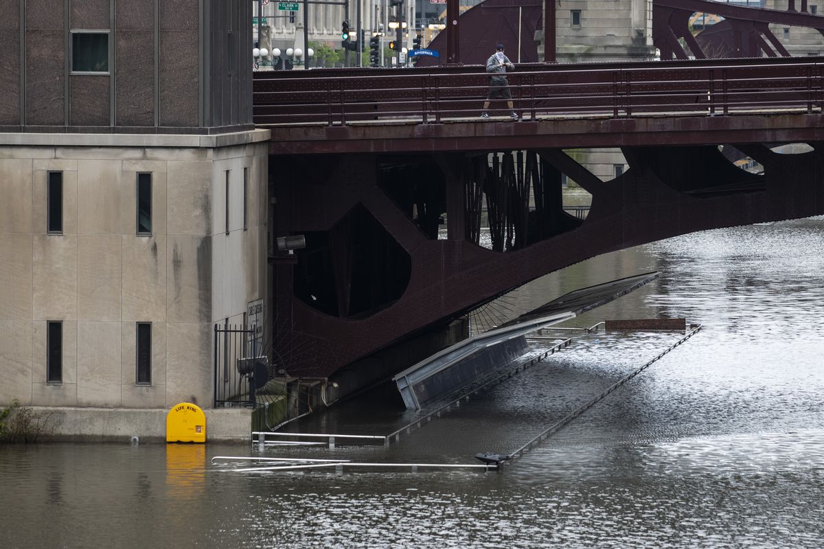 The Chicago River overflowed its banks and flooded the Riverwalk early Monday after a day of showers and thunderstorms across the city.