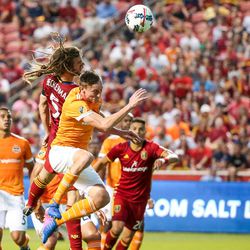 Real Salt Lake midfielder Kyle Beckerman (5) and Houston Dynamo defender Dylan Remick (15) jump for a header during a match at Rio Tinto Stadium in Sandy on Saturday, Aug. 5, 2017.