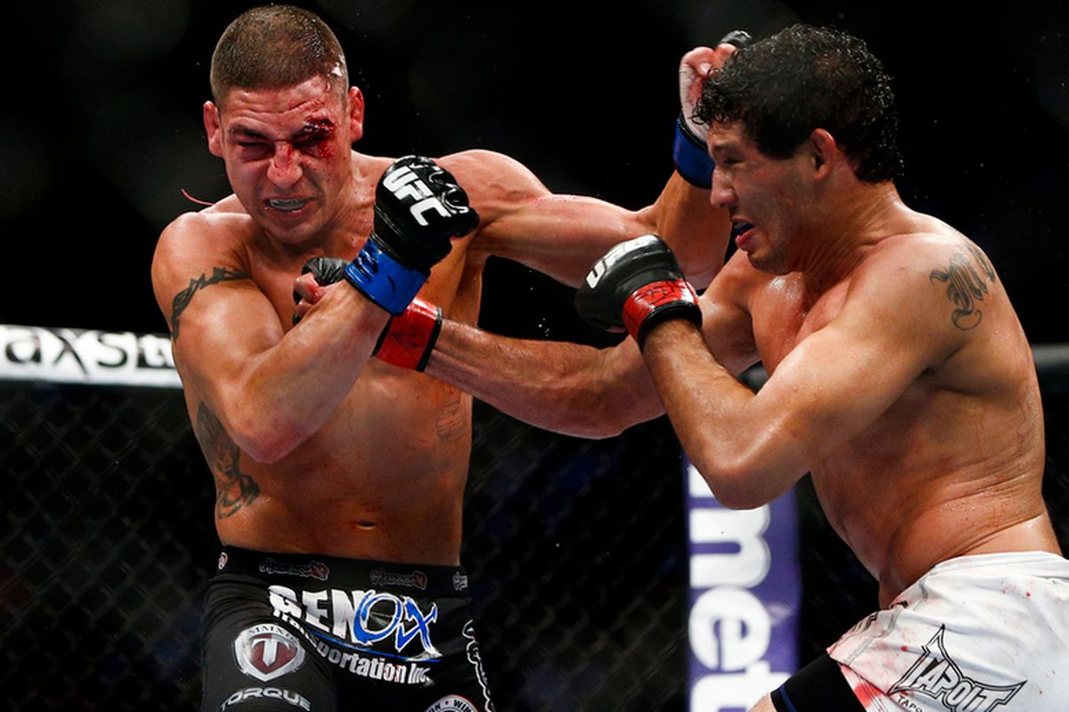 Gilbert Melendez lands on Diego Sanchez with a right hand during UFC 166 at the Toyota Center in Houston, Texas on Saturday, Oct. 19, 2013.