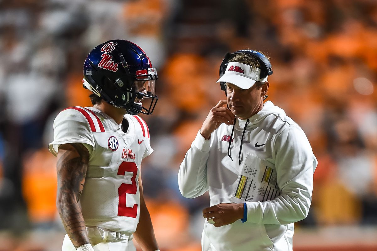 Mississippi Rebels head coach Lane Kiffin talks with quarterback Matt Corral during the first half against the Tennessee Volunteers at Neyland Stadium.&nbsp;