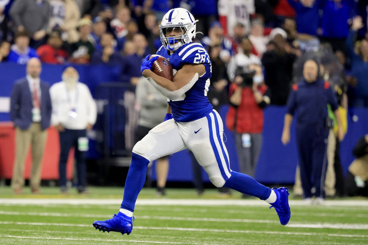 Jonathan Taylor #28 of the Indianapolis Colts rushes for a touchdown during the fourth quarter against the New England Patriots at Lucas Oil Stadium on December 18, 2021 in Indianapolis, Indiana.