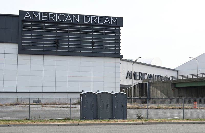 Three portable toilets sit in front of the American Dream mall complex in East Rutherford, New Jersey.