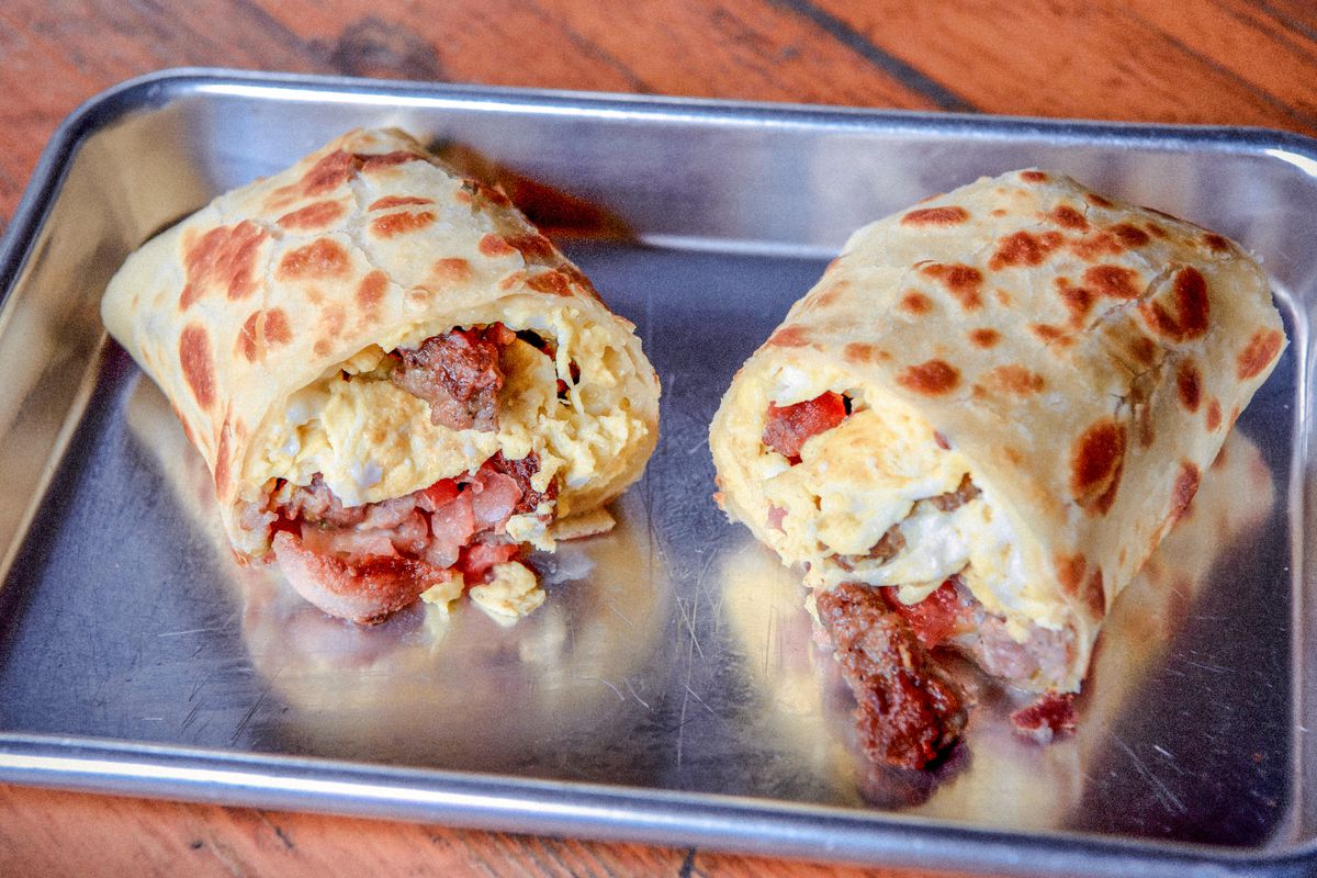 Breakfast burrito stuffed with bacon, scrambled eggs, and cheese at Bell Street Burritos