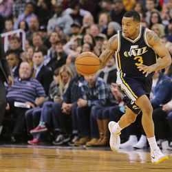 Utah Jazz guard Trey Burke (3) pushes the ball up court as the Jazz and the 76ers play Saturday, Dec. 27, 2014, at EnergySolutions Arena in Salt Lake City. The Jazz won 88-71.
