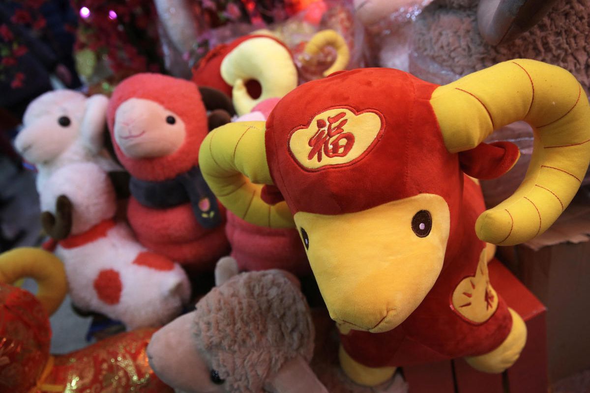 In this Feb. 12, 2015 photo, toy sheep are displayed for sale for Lunar New Year decorations in Beijing, China. Chinese were seeing in the Year of the Sheep on Thursday, Feb. 19 but with fortune-tellers predicting accidents and an unstable economy and som