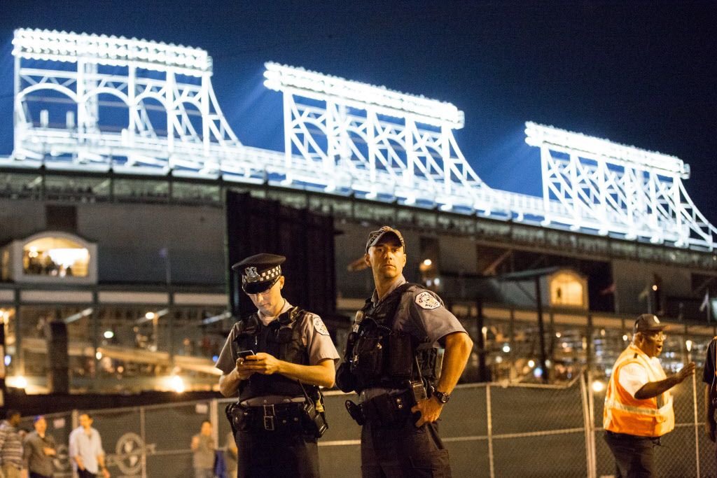 Chicago Police officers outside Wrigley Field on Friday evening. | Santiago Covarrubias/Sun-Times