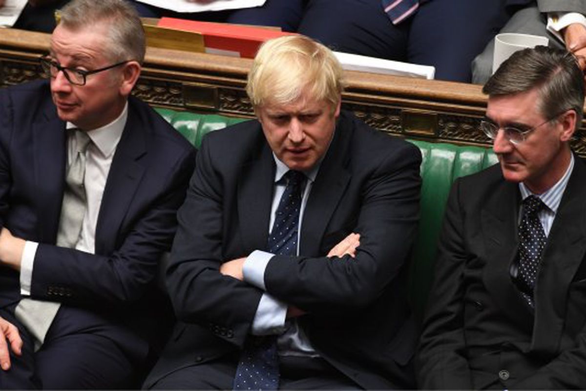 Boris Johnson, Michael Gove, and Jacob Rees-Mogg sit in the House of Commons