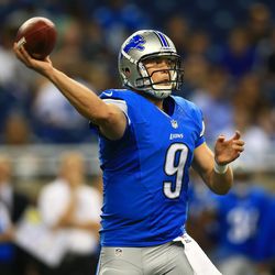 Aug 9, 2013; Detroit, MI, USA; Detroit Lions quarterback Matthew Stafford (9) looks to pass in the first quarter of a preseason game against the New York Jets at Ford Field. 