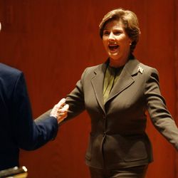 Sen. Orrin Hatch, R-Utah, greets former first lady Laura Bush before her speech at the Hatch's annual Women's Conference at Abravanel Hall in Salt Lake City on Monday, Oct. 26, 2009.