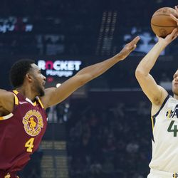 Utah Jazz’s Bojan Bogdanovic (44) shoots over Cleveland Cavaliers’ Evan Mobley (4) in the first half of an NBA basketball game, Sunday, Dec. 5, 2021, in Cleveland. 