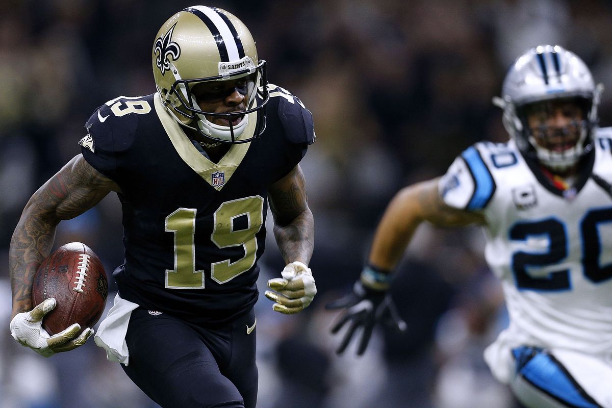 Ted Ginn #19 of the New Orleans Saints catches the ball for a touchdown as Kurt Coleman #20 of the Carolina Panthers defends during the first half of the NFC Wild Card playoff game at the Mercedes-Benz Superdome on January 7, 2018 in New Orleans, Louisiana.