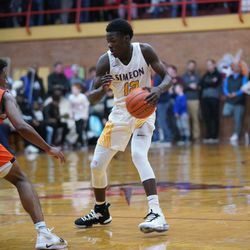 Simeon’s Ahamad Bynum (12) switches direction against Brother Rice’s Marquise Kennedy (24), Friday 03-01-19. Worsom Robinson/For Sun-Times
