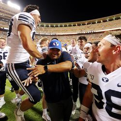 Head coach Kalani Sitake and his players celebrate their win over Tennessee in Knoxville on Saturday, Sept. 7, 2019. BYU won 29-26 in double overtime.