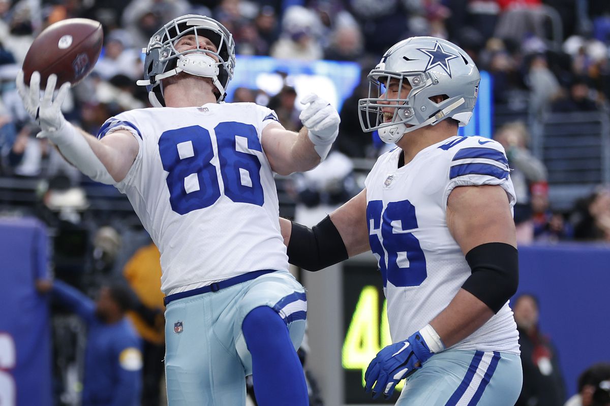 Dalton Schultz #86 of the Dallas Cowboys celebrates his touchdown catch with Connor McGovern #66 during the third quarter against the New York Giants at MetLife Stadium on December 19, 2021 in East Rutherford, New Jersey.
