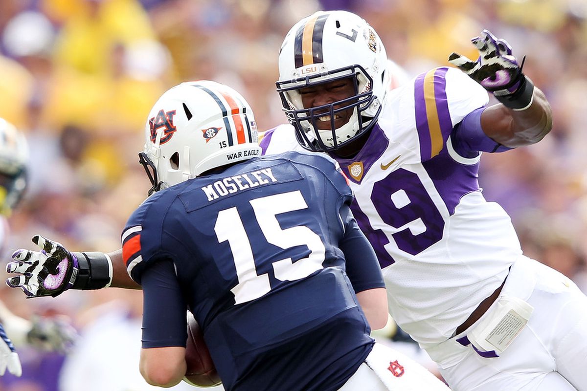 BATON ROUGE, LA - OCTOBER 22:  Barkevious Mingo #49 of the LSU Tigers sacks quarterback Clint Moseley #15 of the Auburn Tigers during the game at Tiger Stadium on October 22, 2011 in Baton Rouge, Louisiana.  (Photo by Jamie Squire/Getty Images)
