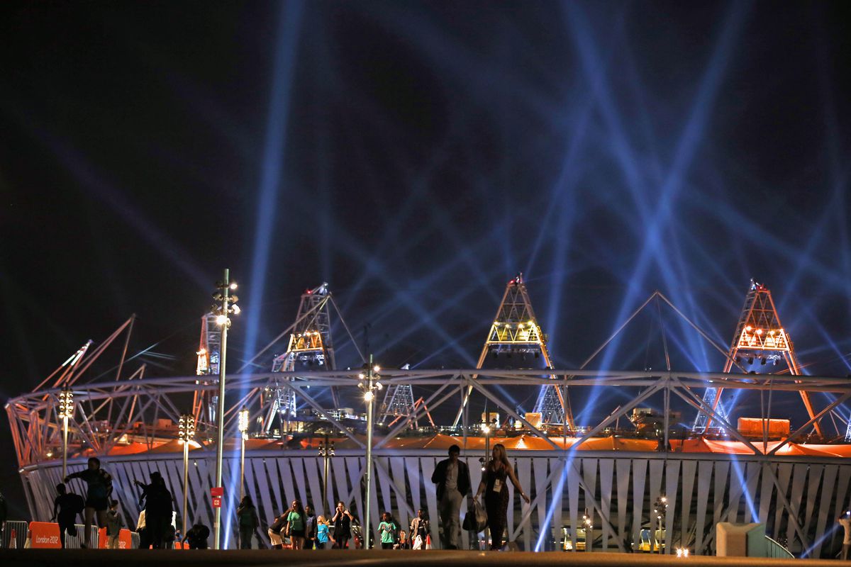 LONDON, ENGLAND - JULY 26: People walk from the Olympic Stadium following an Opening Ceremony rehearsal ahead of the London 2012 Olympics in the Olympic Park on July 26, 2012 in London, England.  (Photo by Jeff J Mitchell/Getty Images)