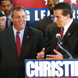 New Jersey Gov. Chris Christie, left, gets the endorsement of Essex County Executive Joe DiVincenzo at McLoone’s Boat House in West Orange, N.J., Tuesday, June 11, 2013.   