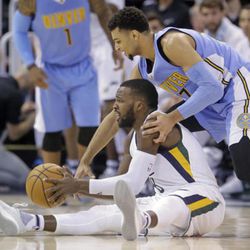 Utah Jazz guard Shelvin Mack (8) and Denver Nuggets guard Jamal Murray, right, compete for a loose ball during the second half of an NBA basketball game Saturday, Dec. 3, 2016, in Salt Lake City. The Jazz won 105-98. (AP Photo/Rick Bowmer)