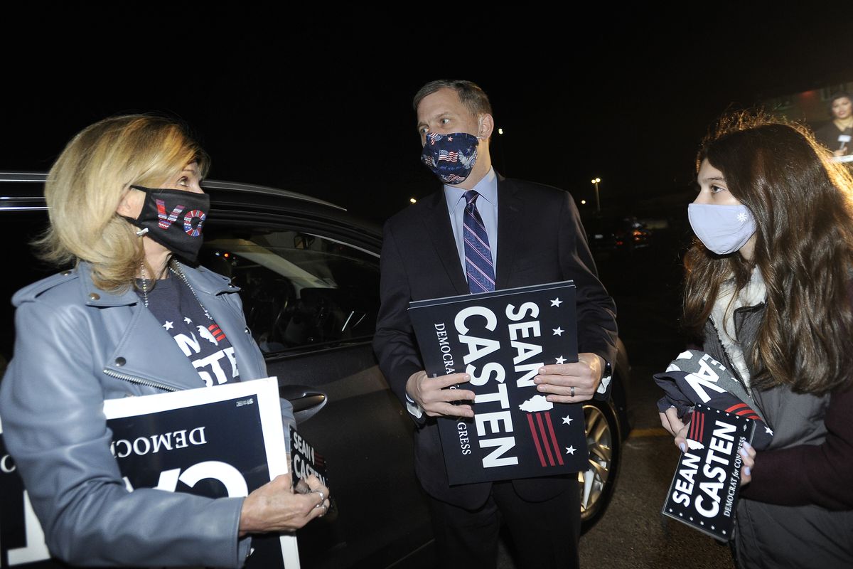 U.S. Representative Sean Casten on Tuesday, November 4, 2020 goes car to car with his daughter Audrey, 13, to thank his supporters like Kim Inman of Palatine as they pass out shirts and water bottles with Casten name on them at the Chicago Drive-In Theater in Hoffman Estates. 