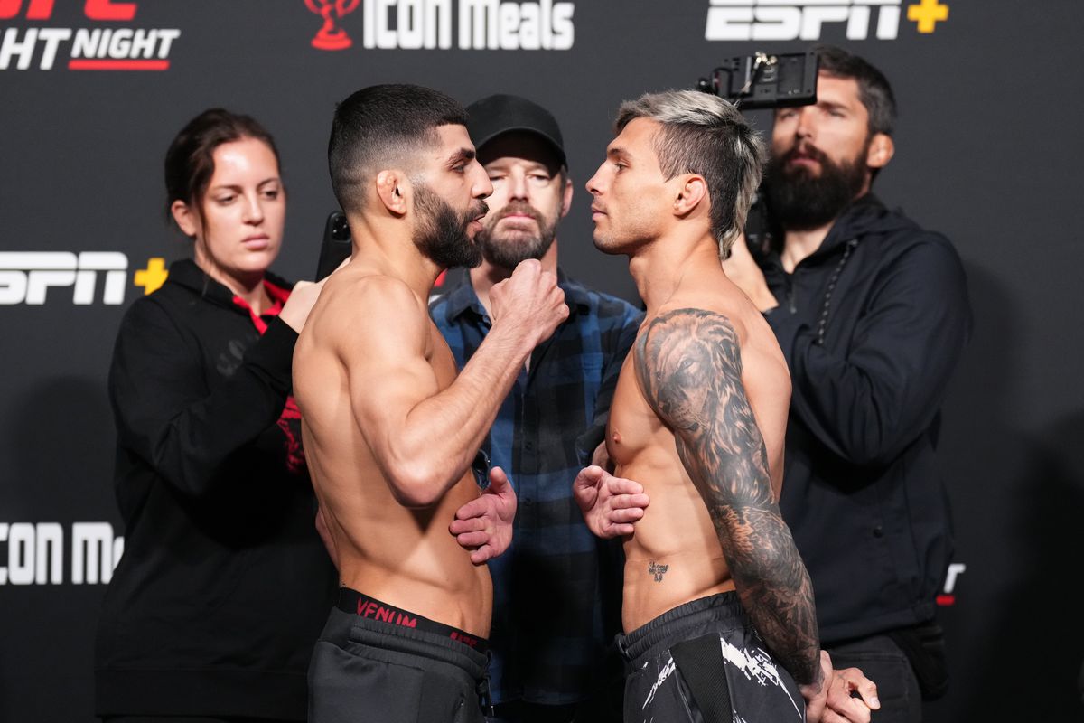 Amir Albazi of Iraq and Alessandro Costa of Brazil face off during the UFC Fight Night weigh-in at UFC APEX on December 16, 2022 in Las Vegas, Nevada.