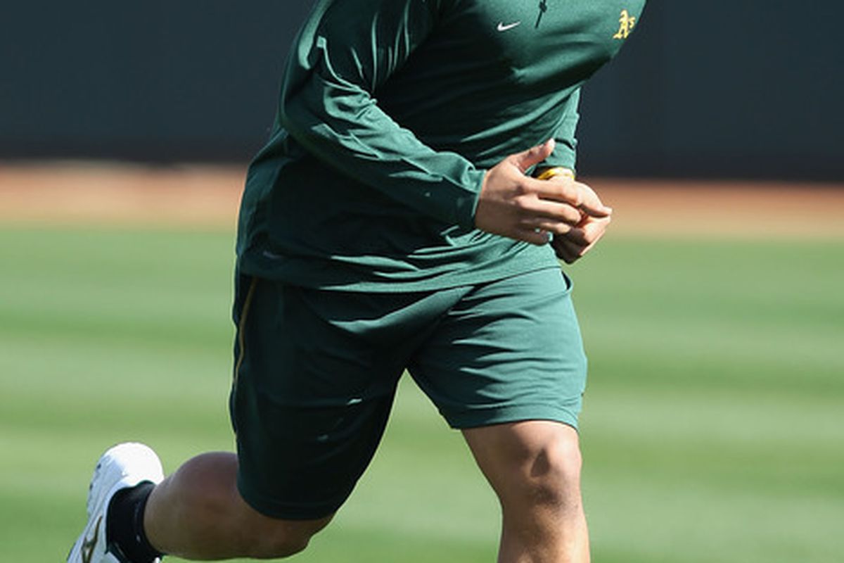 Michael Choice of the Oakland Athletics warms up during a MLB spring training practice at Phoenix Municipal Stadium on February 16 2011 in Phoenix Arizona.  (Photo by Christian Petersen/Getty Images)