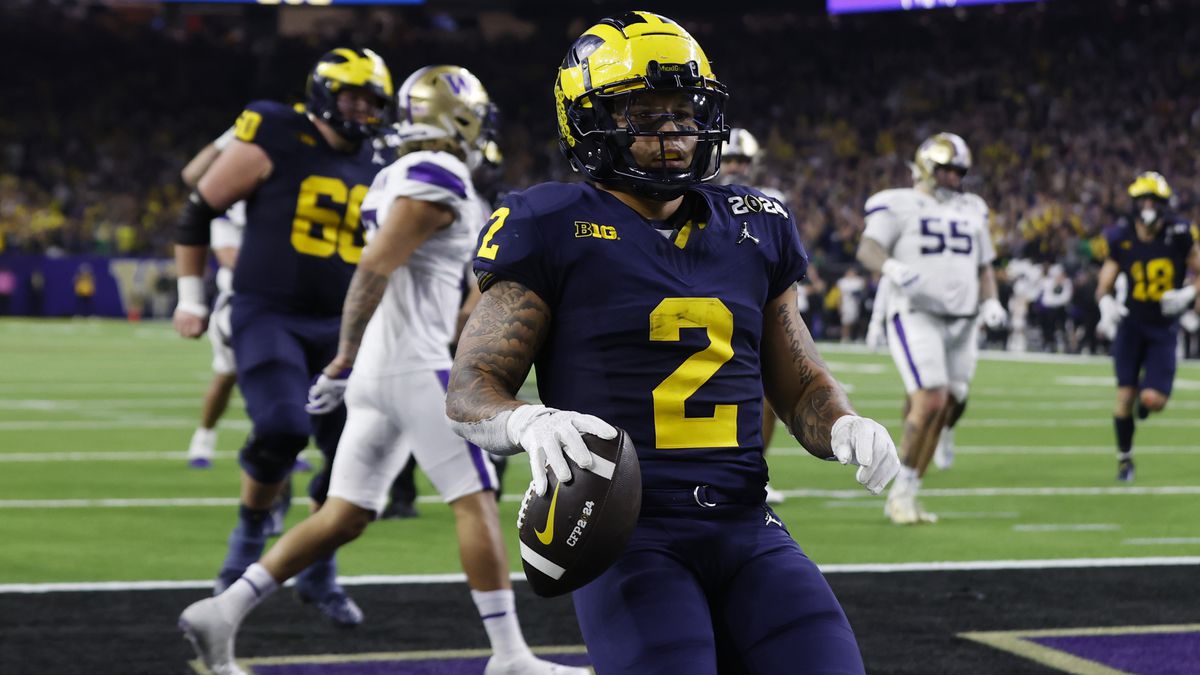 Michigan Wolverines running back Blake Corum #2 runs for a touchdown in the fourth quarter against the Washington Huskies during the 2024 CFP National Championship game at NRG Stadium on January 8, 2024 in Houston, Texas.