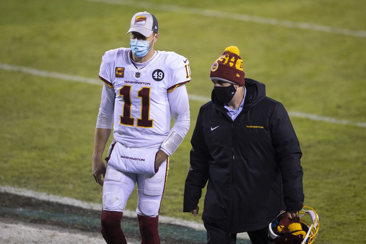 Alex Smith #11 of the Washington Football Team walks off the field after the game against the Philadelphia Eagles at Lincoln Financial Field on January 3, 2021 in Philadelphia, Pennsylvania.