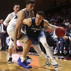 Brigham Young Cougars forward Gavin Baxter (25) defends San Diego Toreros guard Tyler Williams (1) as the BYU Cougars and San Diego Toreros play in WCC tournament action at the Orleans Arena in Las Vegas on Saturday, March 9, 2019. San Diego won 80-57.