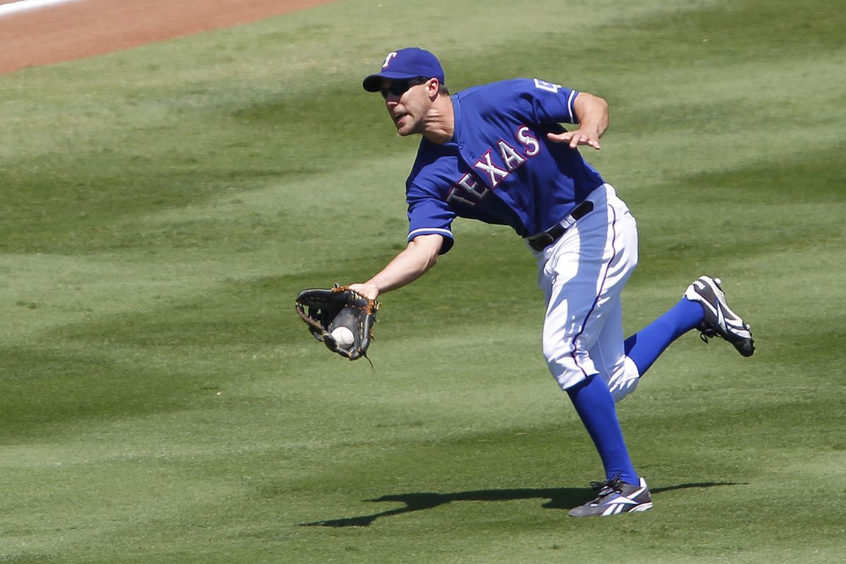 ARLINGTON, TX - MAY 17: David Murphy #7 of the Texas Rangers makes a running catch against the Oakland Athletics at Rangers Ballpark in Arlington on May 17, 2012 in Arlington, Texas. (Photo by Rick Yeatts/Getty Images)