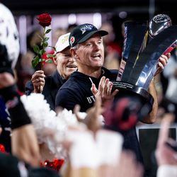 Utah Utes head coach Kyle Whittingham hoists the Pac-12 trophy after the Utes beat the Oregon Ducks in the Pac-12 championship game at Allegiant Stadium in Las Vegas on Friday, Dec. 3, 2021.