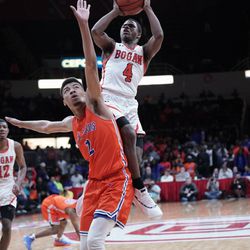East St. Louis’ Richard Robinson (2) tries to block a shot by Bogan’s Jordan Booker (4) in the 3A state championship at Peoria Civic Center in Peoria IL, Saturday 03-16-19. Worsom Robinson/For the Sun-Times