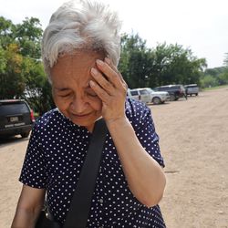 Venezuelan asylum-seeker Neisa Ramos, 74, cries for joy after crossing the Rio Grande, entering the United States and being stopped by Border Patrol in Del Rio, Texas, on Tuesday, June 8, 2021.