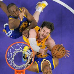 Los Angeles Lakers forward Pau Gasol, center, of Spain, puts up a shot as Golden State Warriors guard Jarrett Jack, below, and forward Carl Landry defend during the first half of their NBA basketball game, Friday, April 12, 2013, in Los Angeles. (AP Photo/Mark J. Terrill)