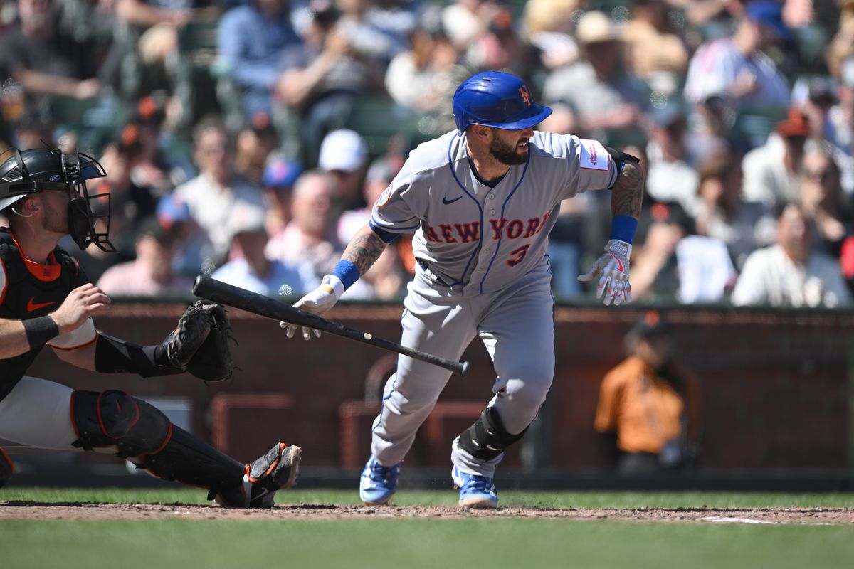 Tomas Nido of the New York Mets bunts in the eight inning of the game against the San Francisco Giants at Oracle Park on April 22, 2023 in San Francisco, California.