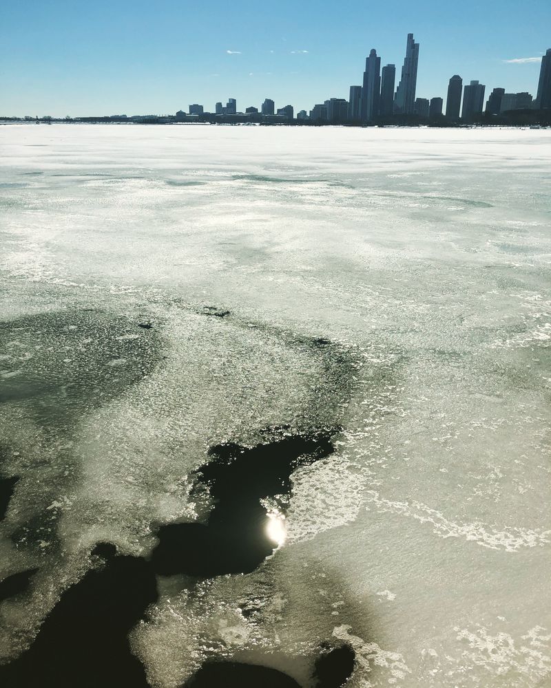 Ice along the Lake Michigan coast is seen melting Feb. 23, 2021.