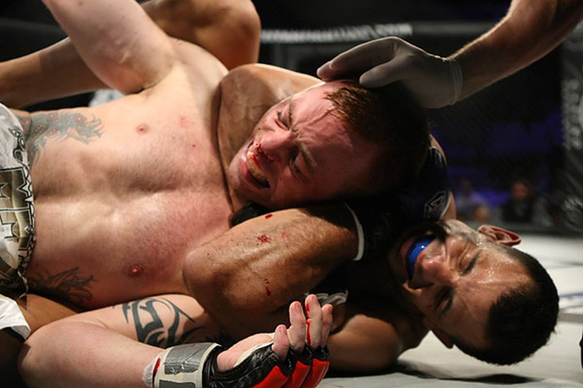 Brian Davidson chokes out Jens Pulver at Titan Fighting Championships 18 in Kansas City, Kansas on Friday night. <strong>Photo by Keith Mills, Sherdog.com</strong>