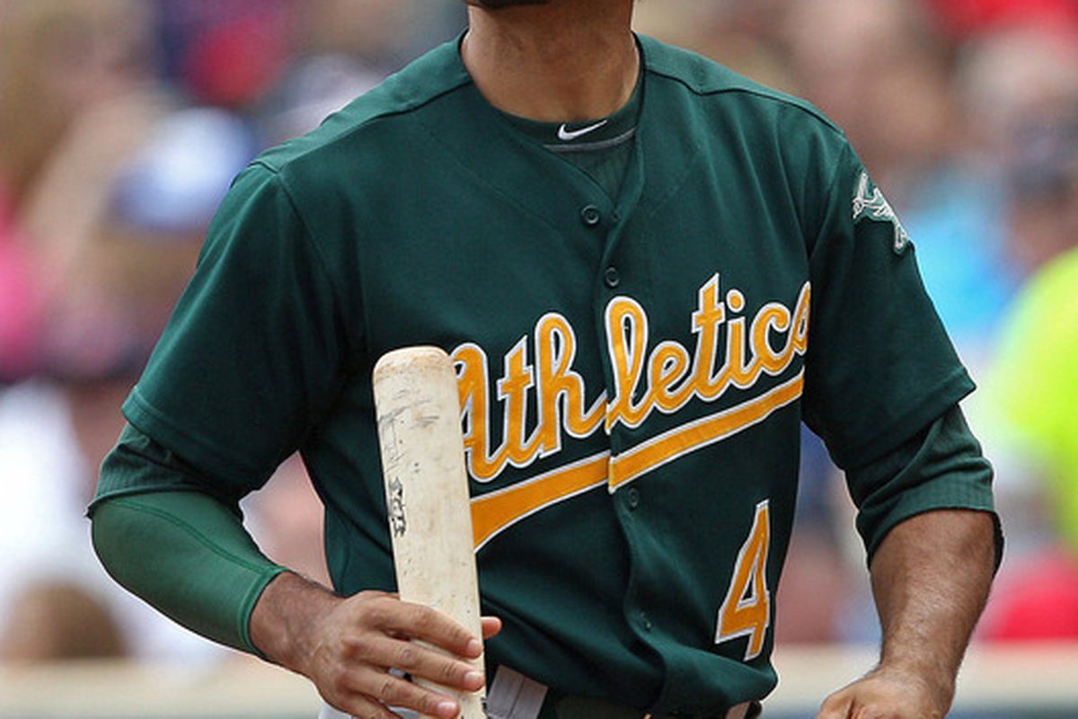 May 30, 2012; Minneapolis, MN, USA: Oakland Athletics center fielder Coco Crisp (4) walks away after striking out in the fifth inning against the Minnesota Twins at Target Field. Mandatory Credit: Jesse Johnson-US PRESSWIRE