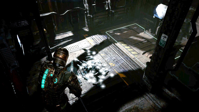 Dead Space Isaac standing in front of a pile of Pulse Rifle ammo gotten through the infinite ammo exploit.