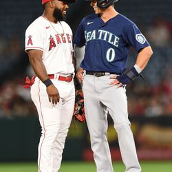 ANAHEIM, CA - AUGUST 16: Los Angeles Angels second baseman Luis Rengifo (2) talks with Seattle Mariners right fielder Sam Haggerty (0) during the MLB game between the Seattle Mariners and the Los Angeles Angels of Anaheim on August 16, 2022 at Angel Stadium of Anaheim in Anaheim, CA.