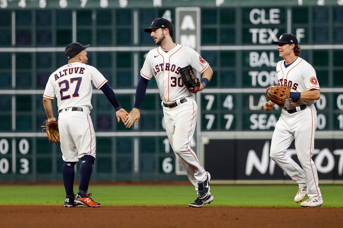 The Houston Astros celebrate after defeating the Oakland Athletics at Minute Maid Park on October 02, 2021 in Houston, Texas.