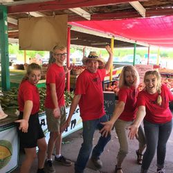 Owner Randy Lemon, middle, manager Marjorie Ross, second from right, and young workers at Grammy's Fruit and Produce in Willard.